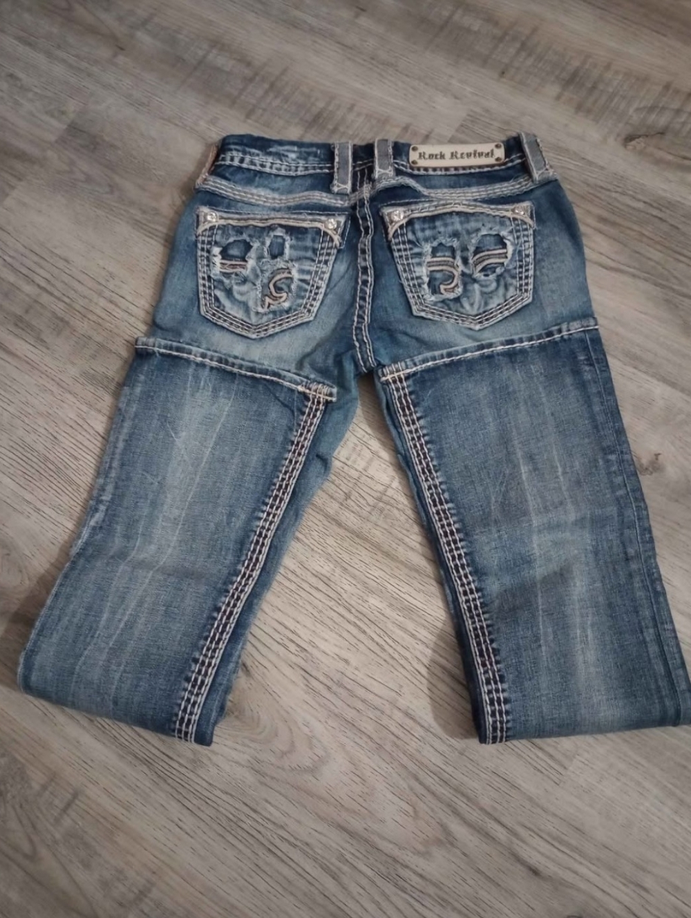 Rock Revival Women’s Boot Cut Jeans in Distressed Blue Wash